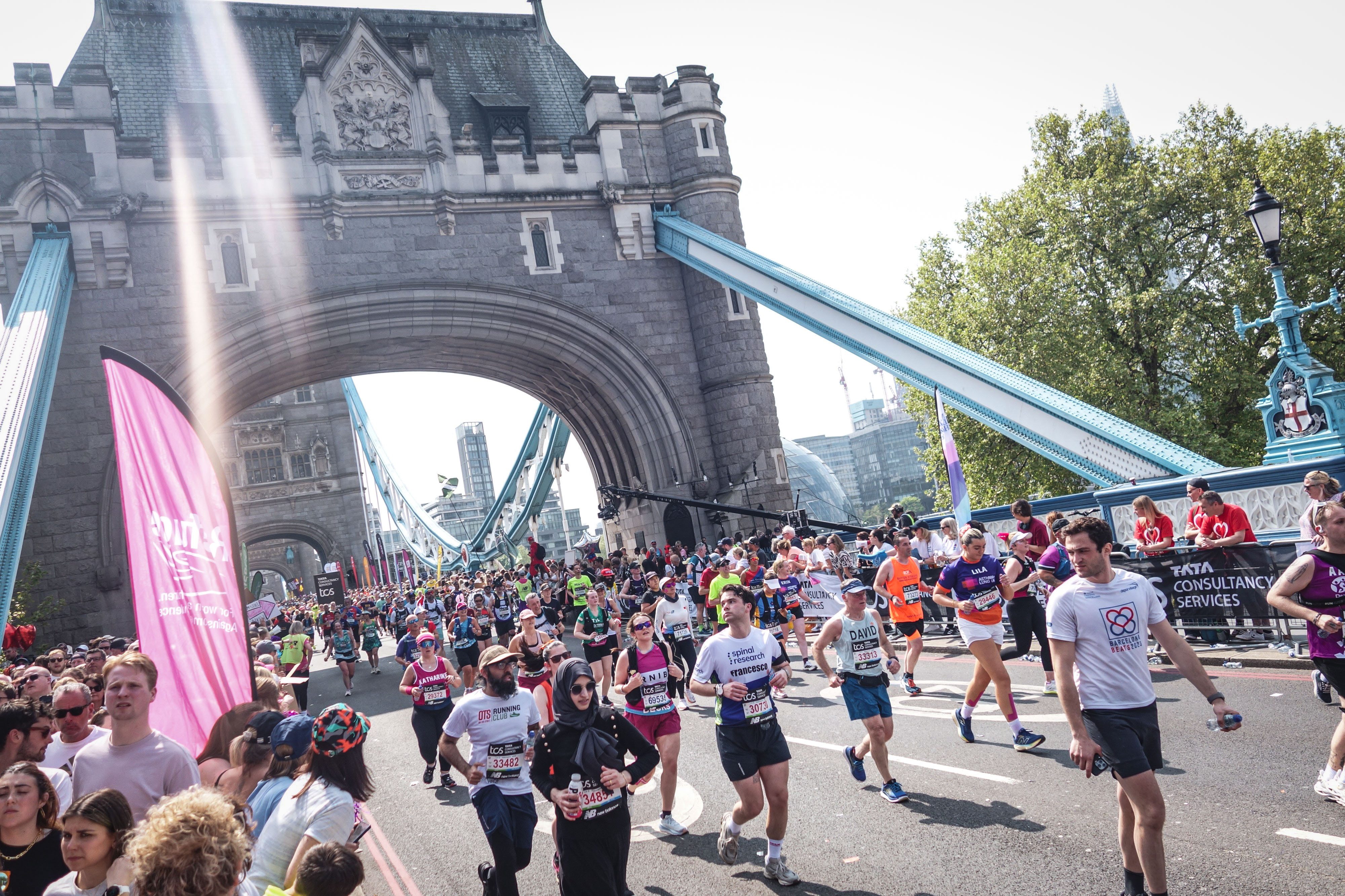 The team on a London bridge during the marathon